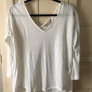 Sheer, white long sleeved top